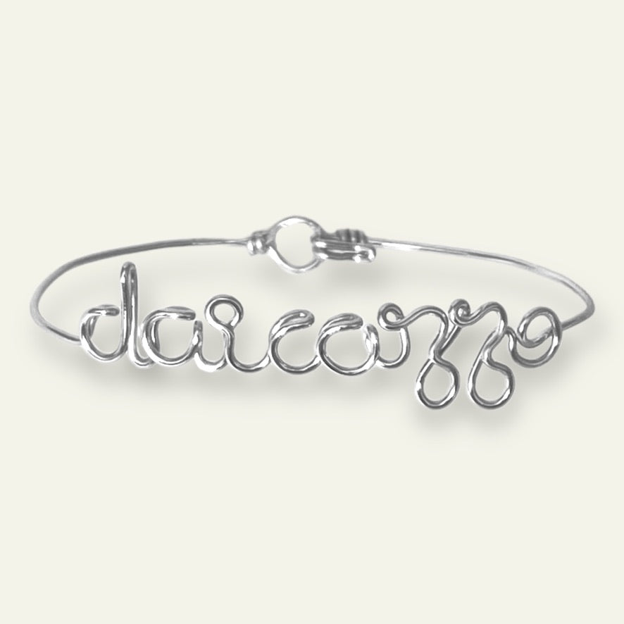 bracciale in filo d'argento con scritto DAI CAZZO