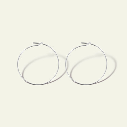 coppia di orecchini a cerchio in sottile filo argento finitura oro rosa